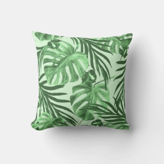 Coussin Feuilles tropicaux et fleurs, motif aquarelle.