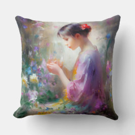 Coussin Fille admirant une fleur dans ses mains