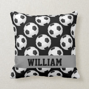 Coussin Le motif de ballon de football folâtre noir et