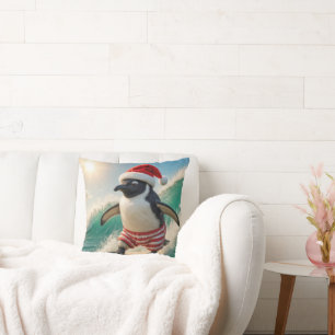 Coussin Manchot de Noël surfant sur une vague océanique