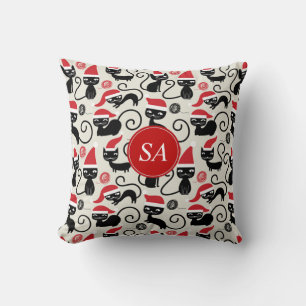 Coussin Monogram Funny chaton de Noël portant le chapeau d