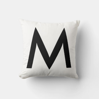 Coussin Monogramme noir élégant sur fond blanc