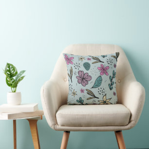 Coussin Motif bleu illustré de fleurs et de feuilles migno