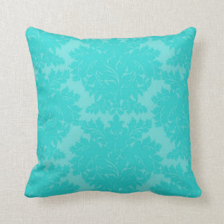 Coussin motif damassé bleu aqua gras orné