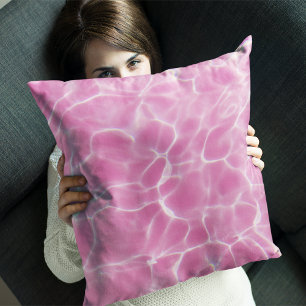 Coussin Motif de lumière de piscine teinté de rose