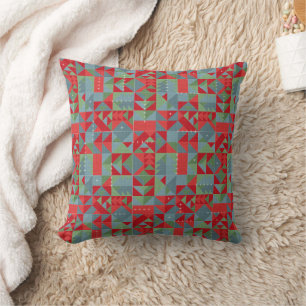 Coussin Motif géométrique rouge, gris et vert.