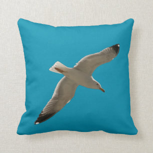 Coussin Mouette sur un ciel bleu