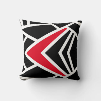Coussin noir, blanc et rouge dans un style abstrai
