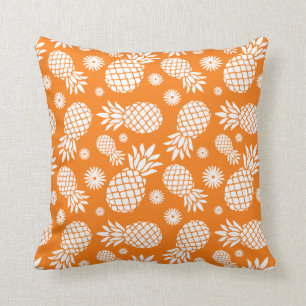 Coussin orange tropical de fleurs graphiques
