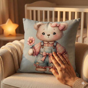 Coussin Ours en peluche pastel tenant une fleur portant un