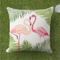 Paire de flamants roses tropicaux sur une fronde d