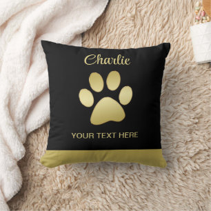 Coussin Paw chien brillant or sur arrière - plan noir
