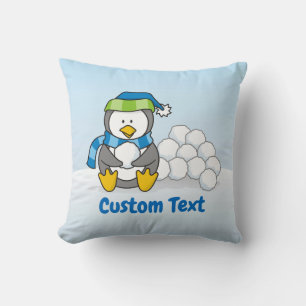 Coussin Petit pingouin assis avec des boules de neige