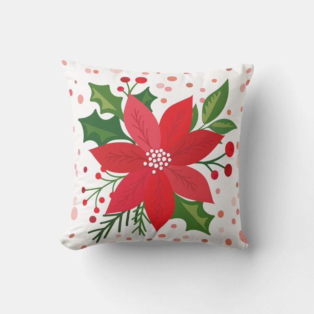 Coussin Poinsettia rouge (A square throw pillow features a festive holiday design.)