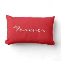 Coussin rouge et blanc avec l'écriture pour toujou