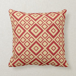 Coussin rouge et crème de motif de diamant