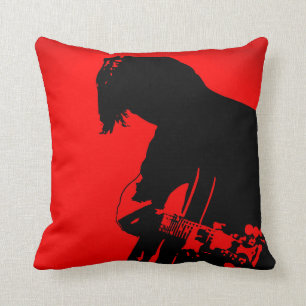 Coussin rouge et noir de joueur de guitare