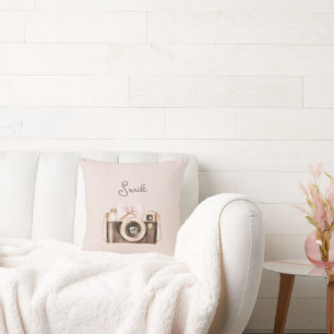 Coussin Sourire à l'appareil photo marron avec un nœud ros