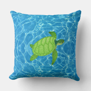 Coussin Tortue verte sur eau turquoise