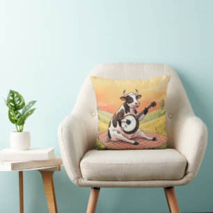 Coussin Vache jouant du banjo sur une couverture