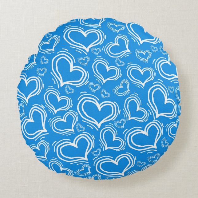 COUSSINS RONDS BLEU CLAIR AVEC COEURS BLANCS ET FLEURS (Devant)
