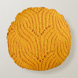Coussins Ronds Chandail en tricot orange, arrière - plan texturé.