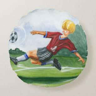 Coussins Ronds Footballeur donnant un coup de pied une boule par