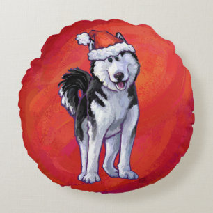 Coussins Ronds Husky avec un chapeau de Père Noël rouge