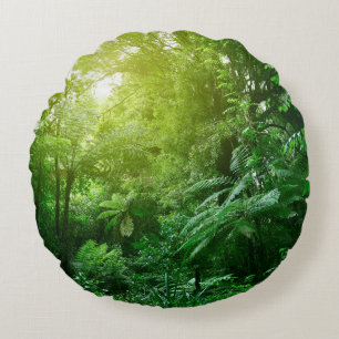 Coussins Ronds Un couvert d'arbres illuminé dans la jungle tropic