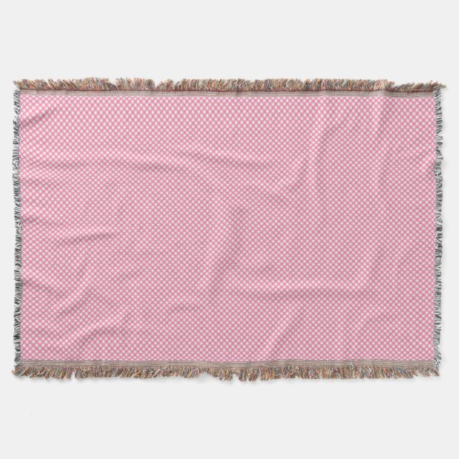 Couverture A pink woven blanket with a subtle pattern  (Devant)