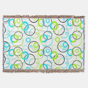 Couverture anneaux et cercles bleus, verts et noirs sur fond