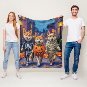 Couverture Polaire Chiens Akita demandant des friandises lors d'Hallo