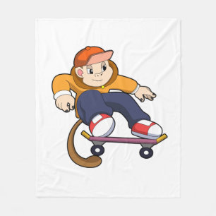 Couverture Polaire Singe comme patineur avec skateboard
