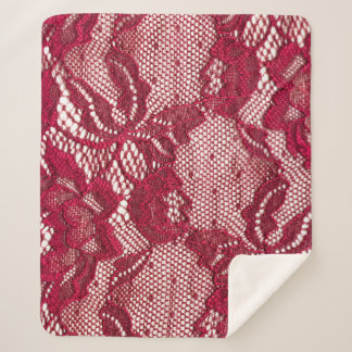 Couverture Sherpa Dentelle rouge : textile jacquard élastique.