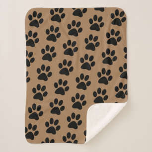 Couverture Sherpa empreintes de pattes noirs sur brun
