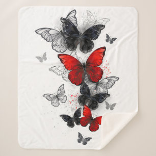 Couverture Sherpa Papillons noirs et rouges volants