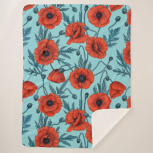 Couverture Sherpa Poppies, rouge et bleu sur le bleu de la piscine