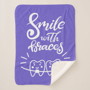 Couverture Sherpa Sourire avec les dents de sourire des croisillons