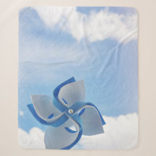 Couverture Sherpa Vaisseau blanc et bleu sous ciel nuageux