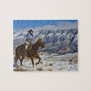 Cowboy auf Pferd mit Lederschäften