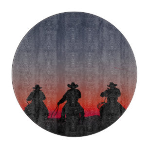 Cowboy bei Sonnenuntergang Schneidebrett