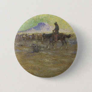 Cowboy beim Hüten von Rindern auf der Range von Lo Button