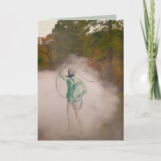 Cowboy man roping stirring up dust out west karte