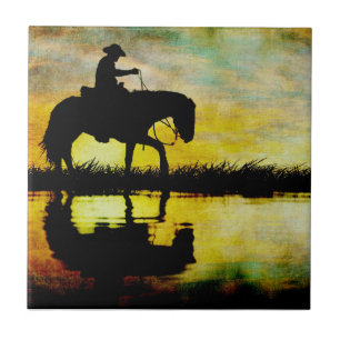 Cowboy zu Pferd am Sonnenuntergang Fliese