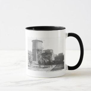 Cowboys auf Pferden posieren vor einem Zug Tasse