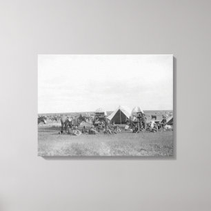 Cowboys, die um Chuckwagon Fotografie sitzen Leinwanddruck