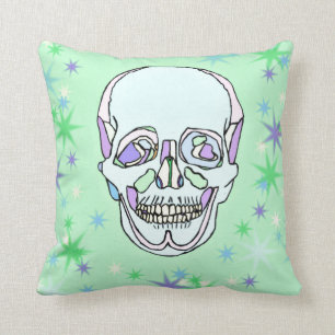 Crâne en pastel et coussin verts et pourpres