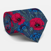Coquelicots rouges et fleurs bleues sur bleu