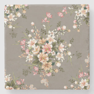 Creme, rosa Blume auf grau. Steinuntersetzer