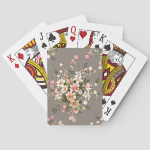 Cremefarbene, rosa Blüten auf Grau. Spielkarten